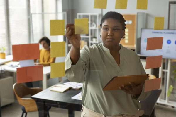 front-view-woman-working-with-post-its
